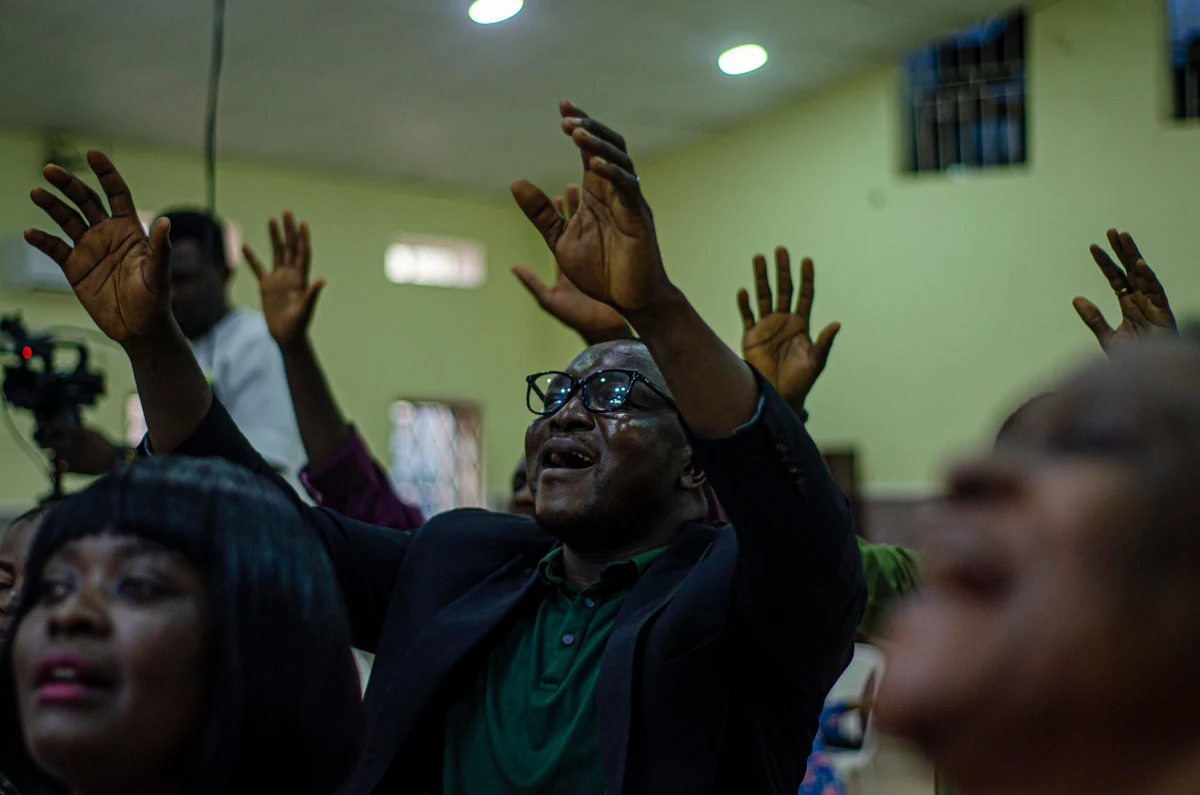 Members of the Riverside congregation worshipping